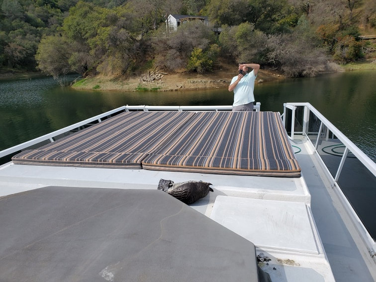 Custom padded sundeck designed and constructed by James Boat and Fiberglass Repair, Dixon, CA for this large houseboat