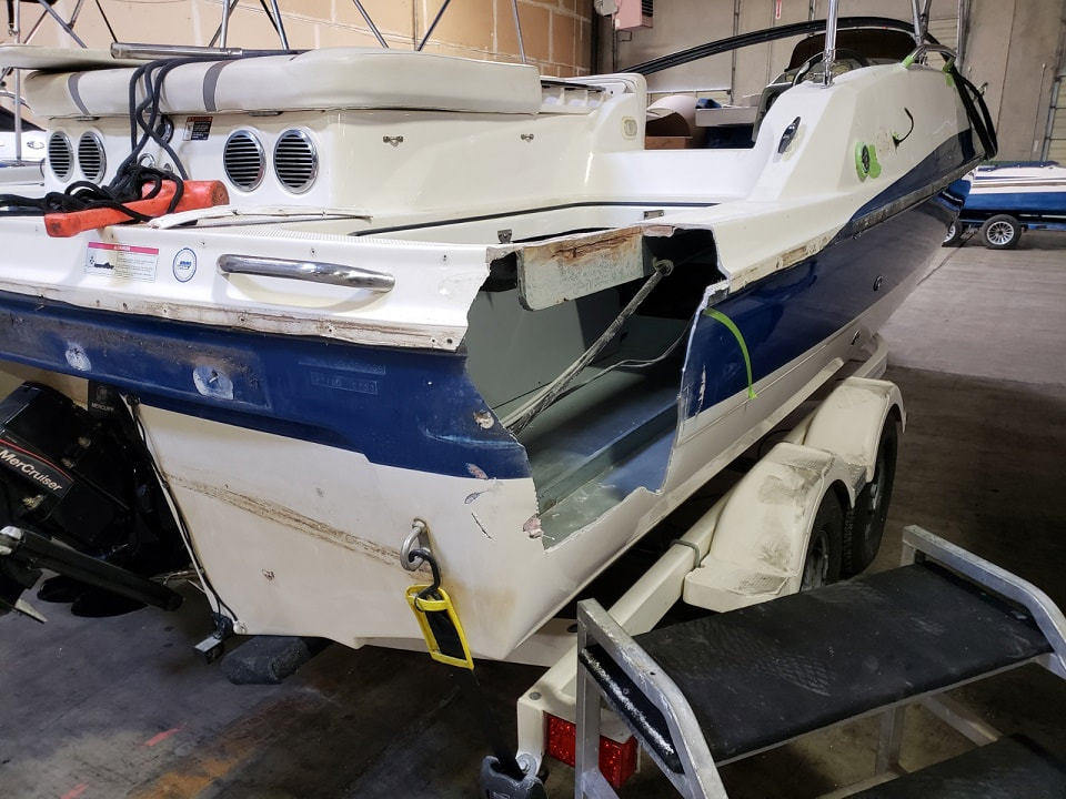 2006 Bayliner 217 Deck Boat, before picture where damaged in back before repair by James Boat and Fiberglass Repair, Vacaville, CA 