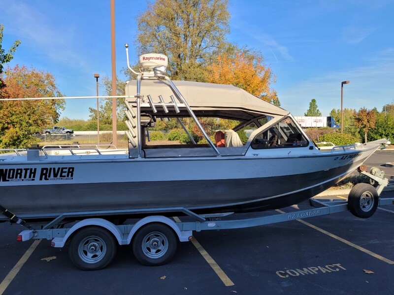 Side view of North River fishing boat deck with new top designed and installed using new Tuffak polycarbonate by James Boat Fiberglass and Upholstery, Dixon, CA