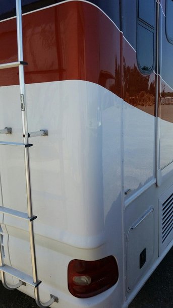 After photo of rear quarter panel of damaged RV.  New fiberglass and color.